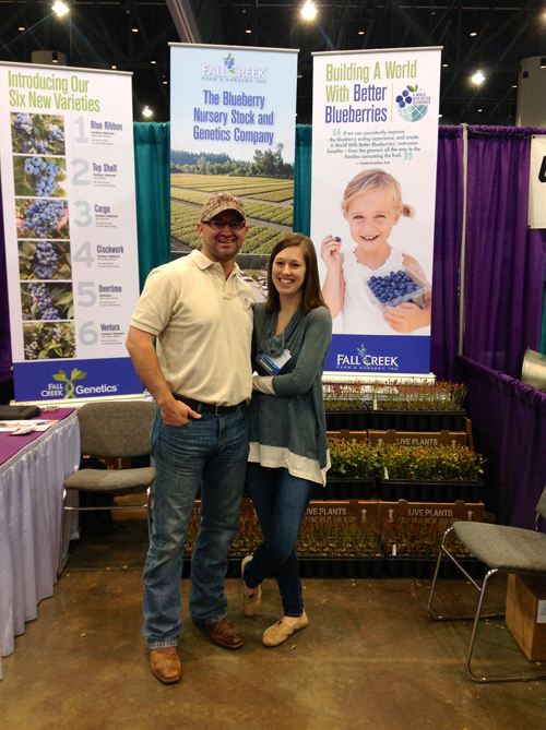 Fall Creek's Winn Morgan and his wife, Camille, pose in the booth at the SE Fruit & Vegetable Conference! 